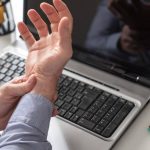 Worker suffering from carpal tunnel syndrome